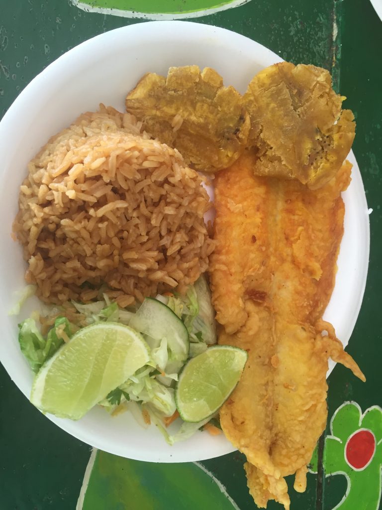 Typical local lunch: fried fish, coconut rice and fried plantains